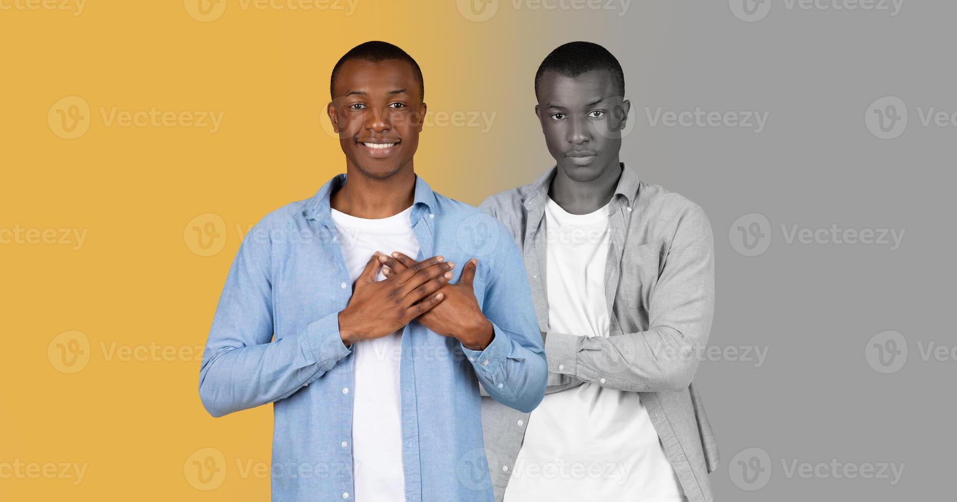 Black man confidently poses. The background features a striking two-tone design, with one side in vibrant yellow and the other in muted gray, highlighting his expression. photo