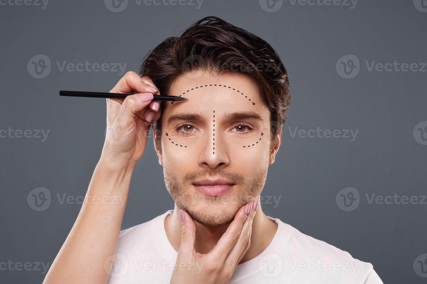 Plastic surgery concept. Surgeon drawing marks on male face on gray background, panorama photo