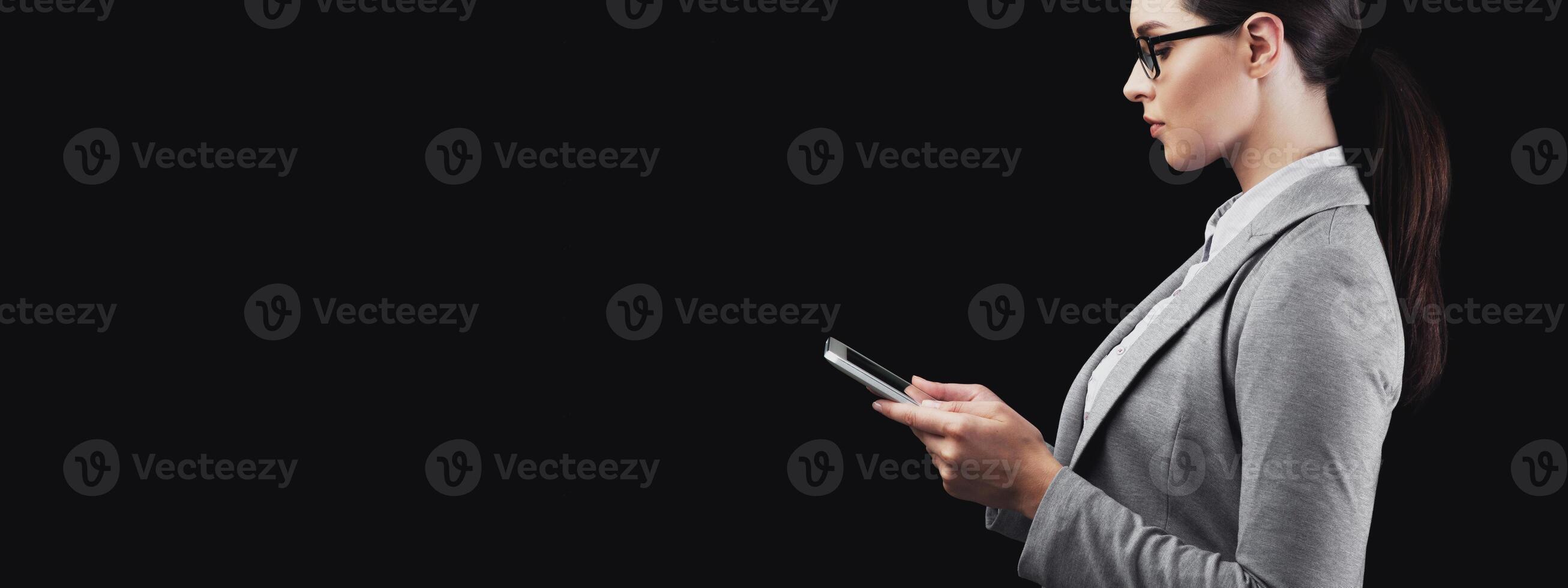 ID Recognition. Businesswoman Using Mobile Phone Scanning Face Identifying Person On Black Background In Studio. Panorama, Side View photo
