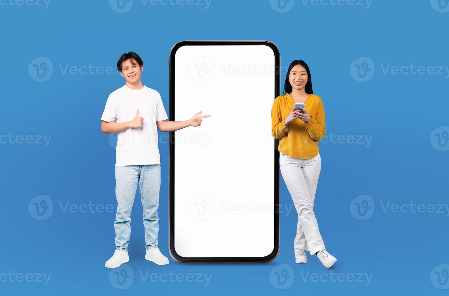 Chinese man and a woman are standing next to a large phone, presumably engaged in a conversation, mockup, copy space, mobile app photo