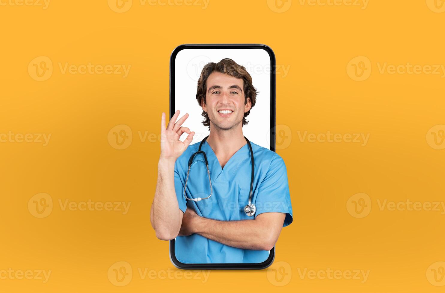 Featuring modern telehealth services, this image shows a young man doctor on a smartphone screen, isolated on yellow studio background photo
