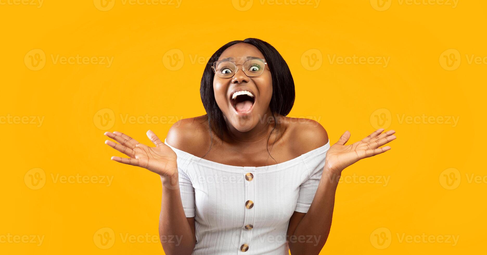 Excited Black Lady Screaming Looking At Camera Holding Hands Near Face Standing On Orange Background In Studio. Panorama photo
