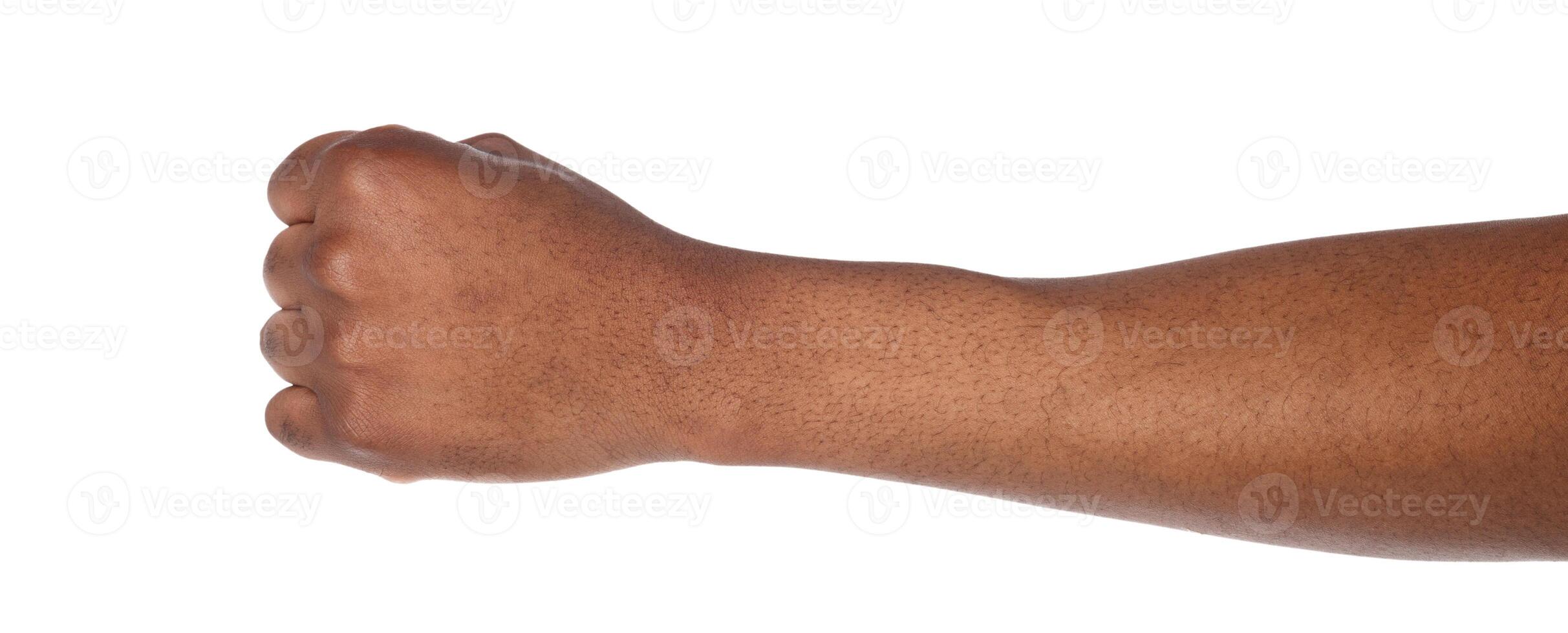 Male black fist isolated on white background. African american clenched hand, gesturing away. Counting, aggression, brave, masculinity concept photo