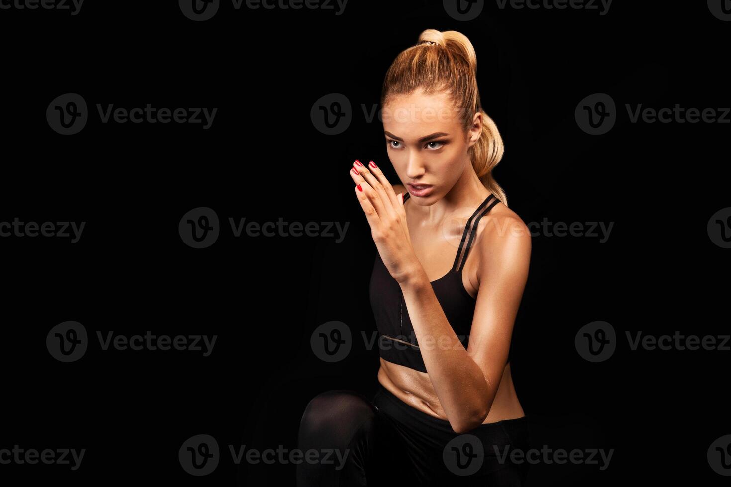 Spot Jogging. Motivated Lady Running In Place Exercising Over Black Studio Background. Emtpy Space For Text photo