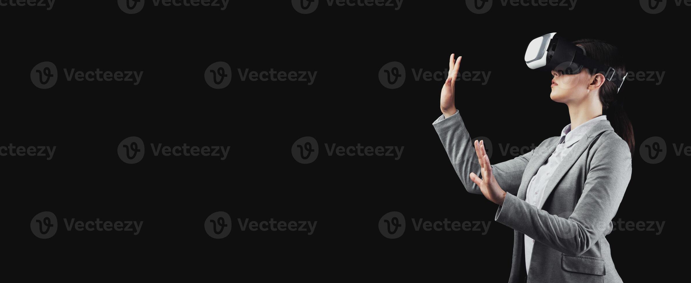 Business Future. Businesswoman Using Virtual Reality Headset On Black Background In Studio. Free Space For Text photo
