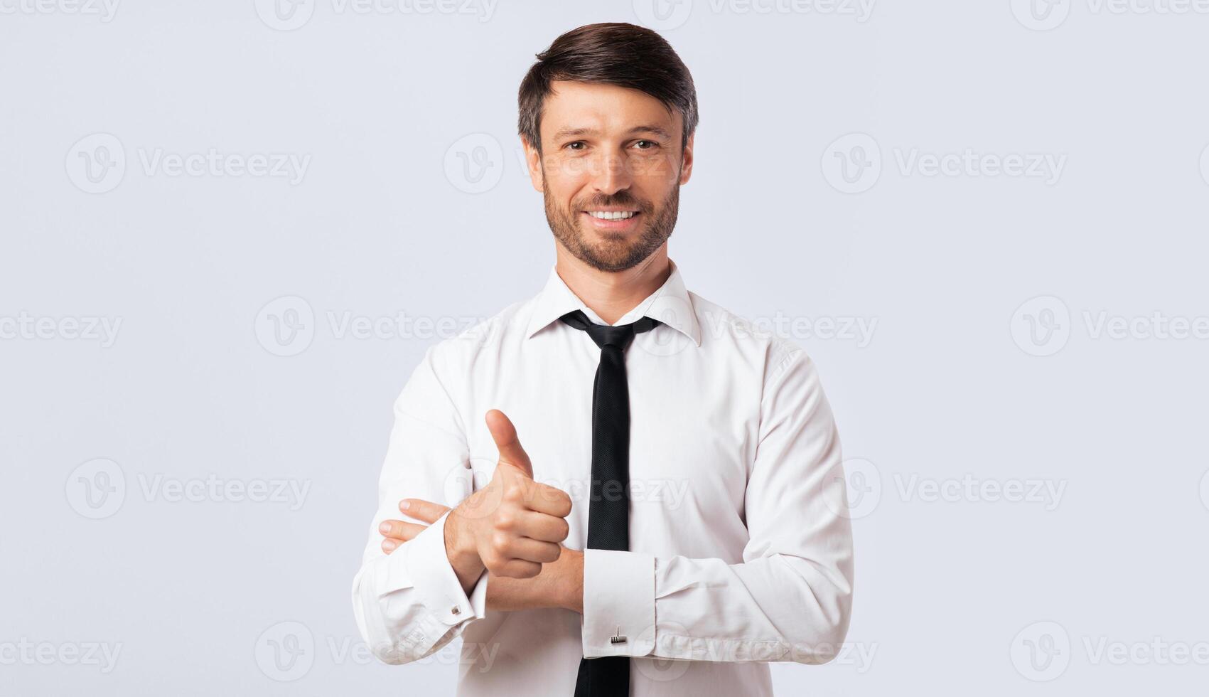 Like. Positive Businessman Gesturing Thumbs Up Smiling At Camera Over White Background. Isolated, Studio Shot, Free Space photo