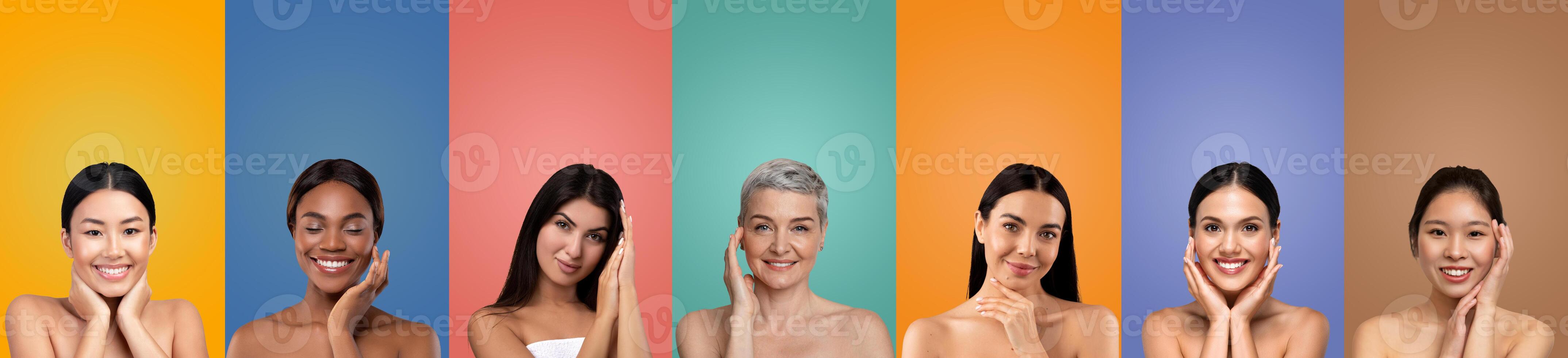 Seven diverse women with different skin tones and hair colors smile at the camera with their hands on their cheeks. They are positioned against a colorful background photo