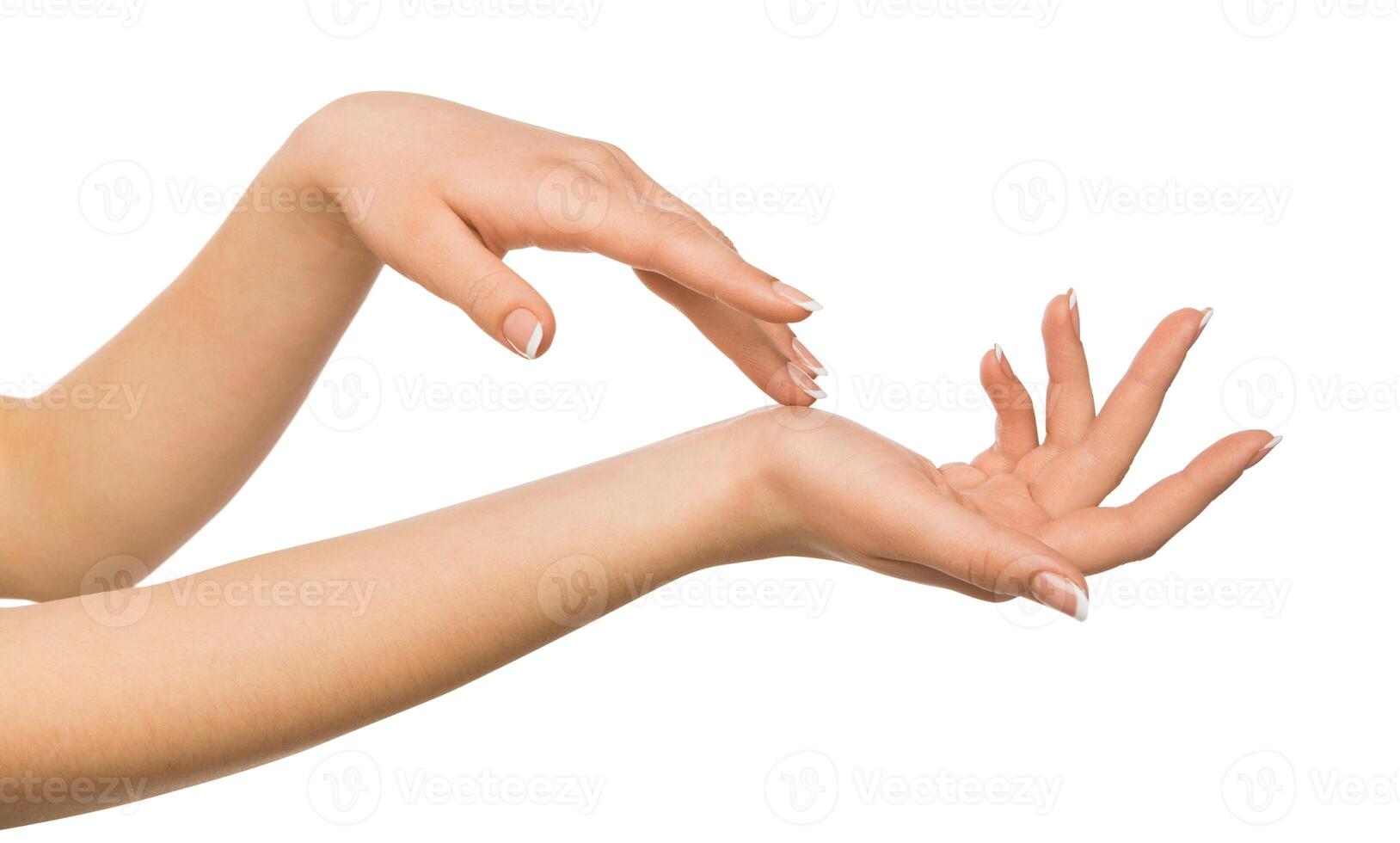 Beauty and skincare concept - beautiful female hands with french manicure, woman touching skin after spa treatment isolated on studio white background, close-up, cutout photo