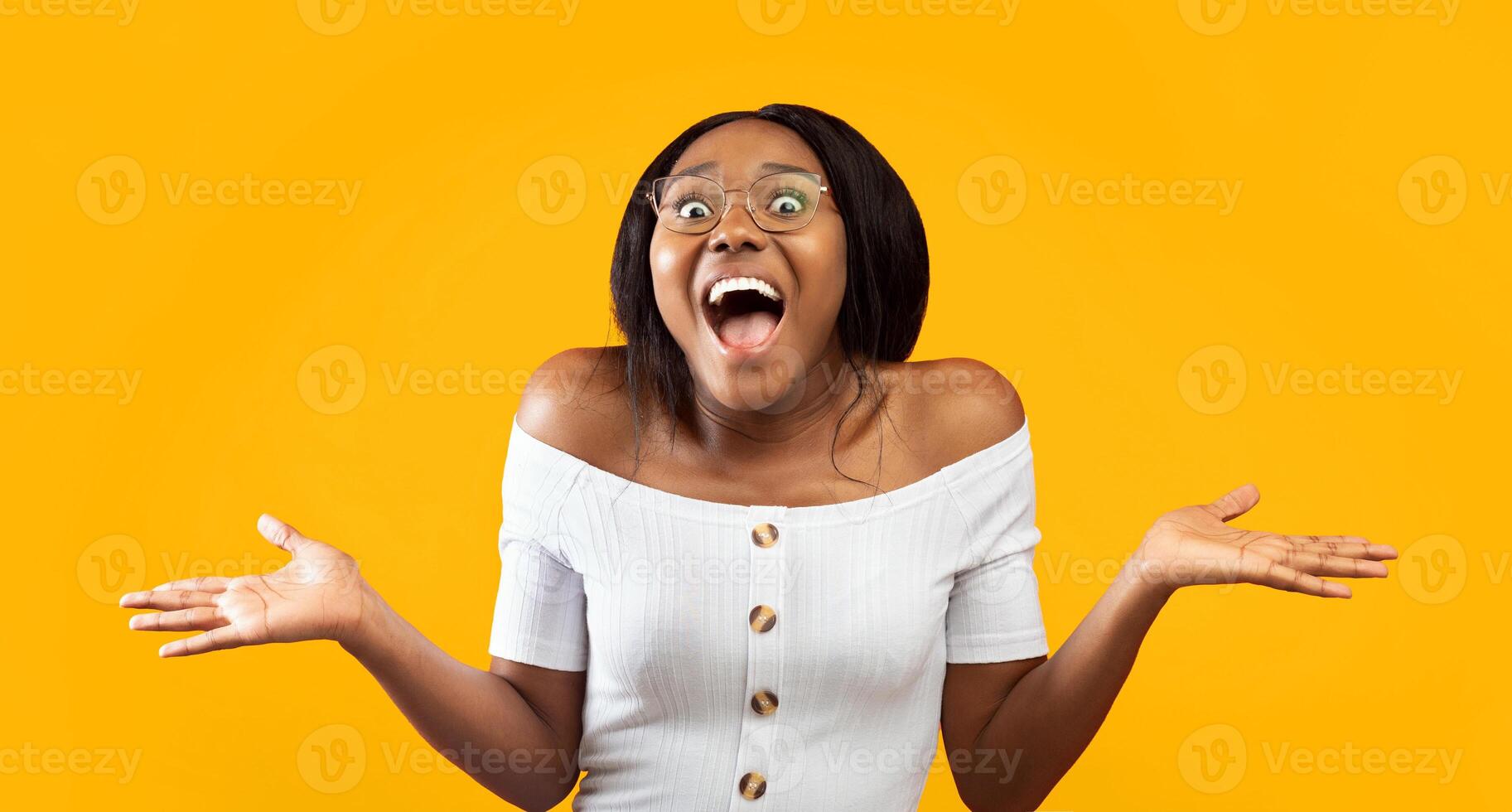 Wow. Excited Afro Girl Shouting Looking At Camera Gesturing With Hands Standing On Orange Studio Background. Panorama photo