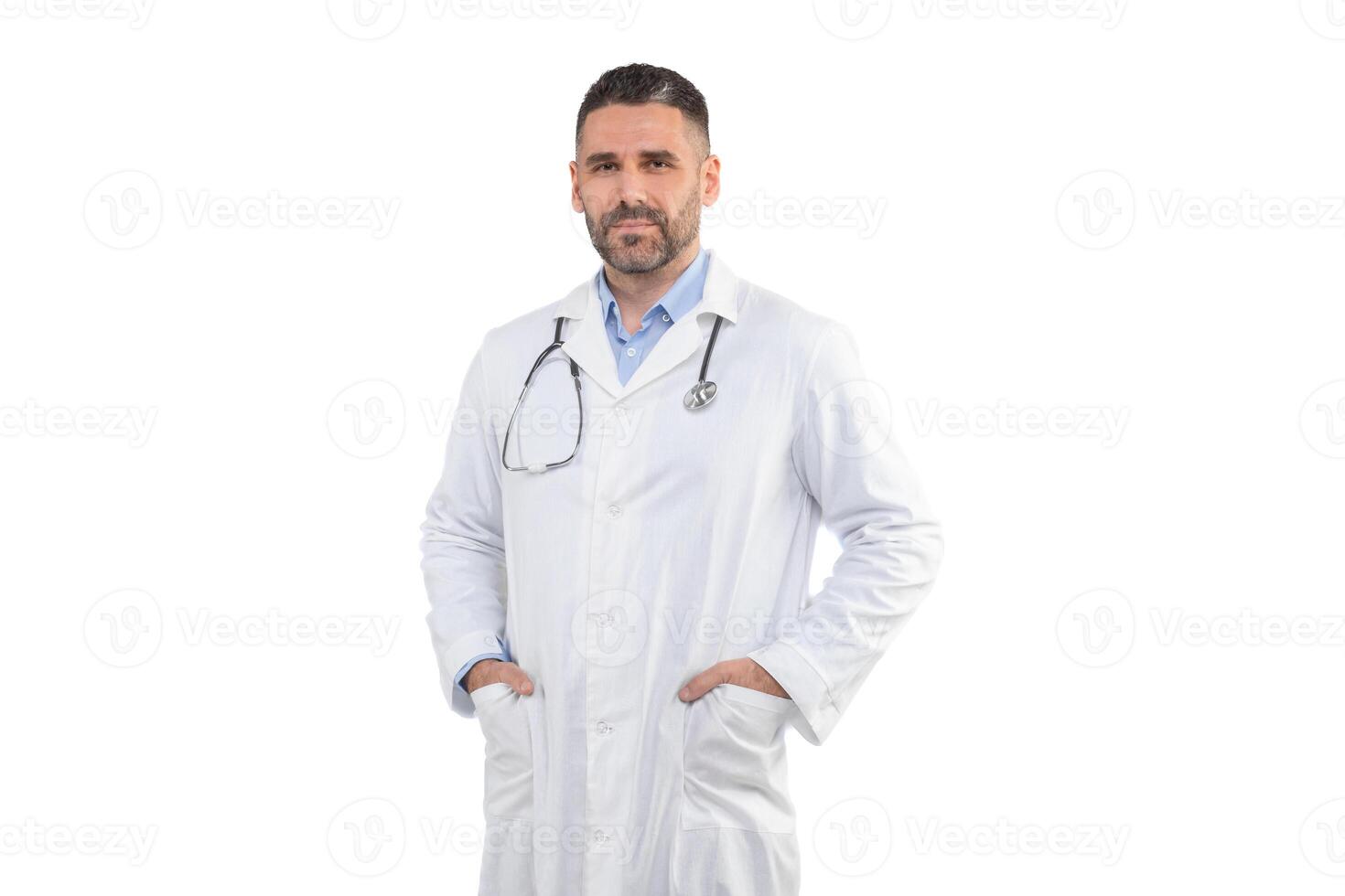 A man doctor is standing with his hands in his pockets, wearing a white lab coat and stethoscope, against a plain white background. He looks professional and ready to assist patients. photo