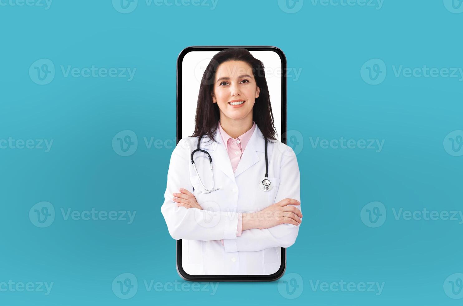 Woman doctor wearing a white coat and stethoscope is conducting a virtual consultation. The telemedicine technology, with her appearing through a smartphone screen against a blue background. photo