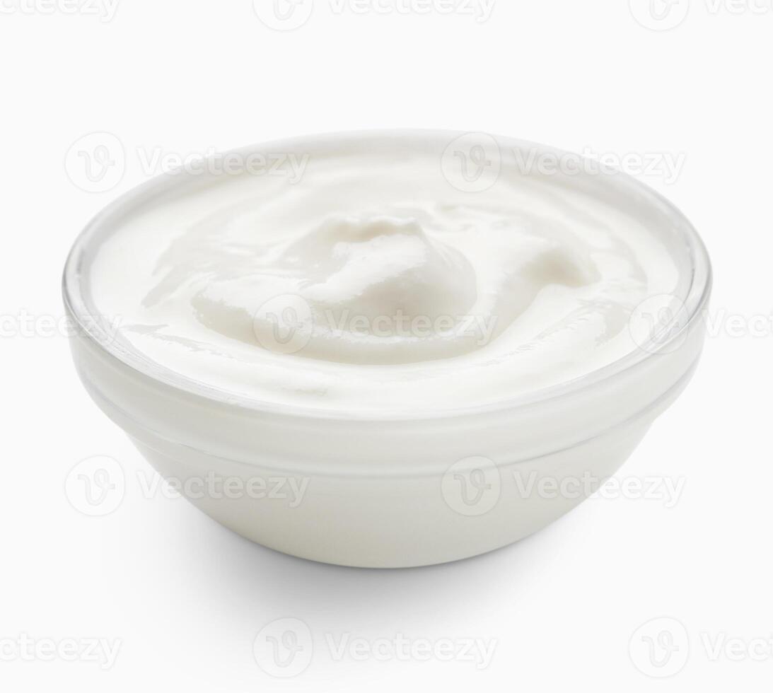 Glass bowl of organic yogurt on white background. photo