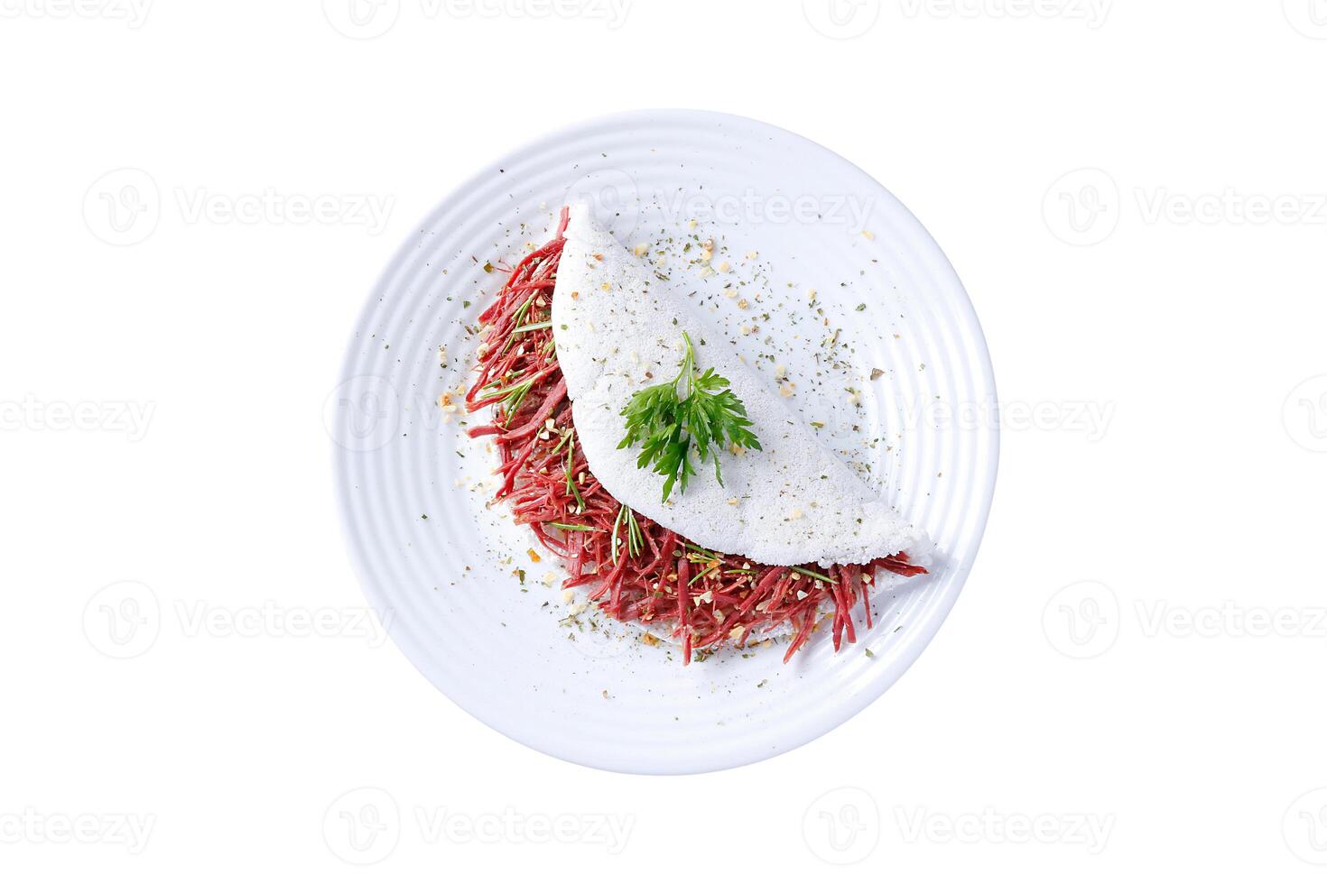Tapioca or beiju stuffed with dried meat, jerked beef isolated on white background photo
