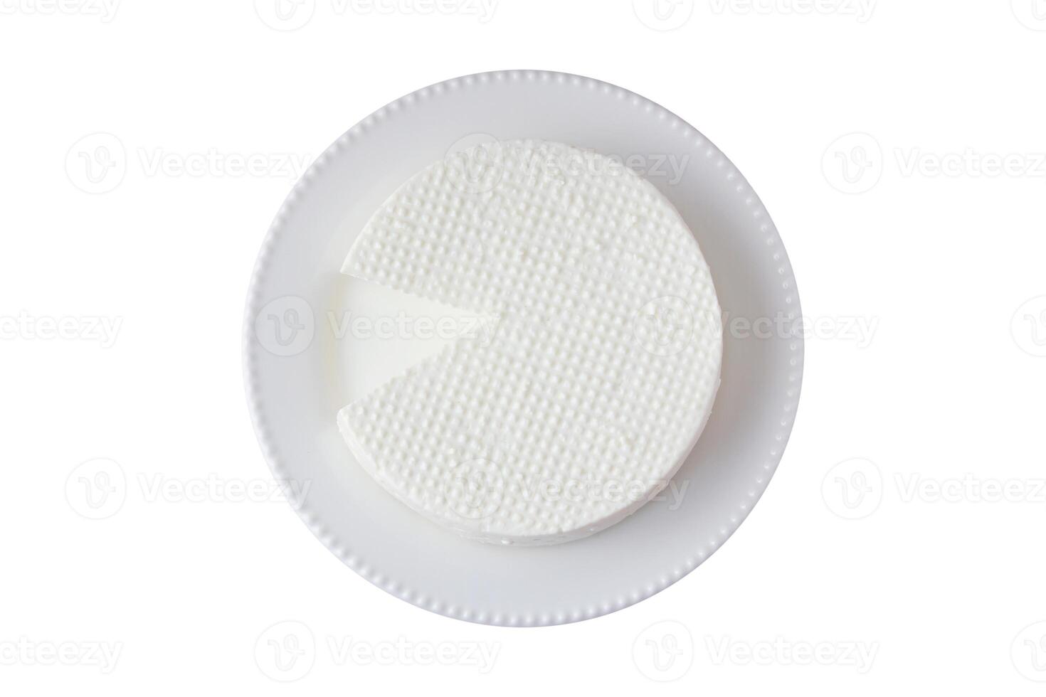 fresh brazilian white minas cheese on white plate isolated on white background photo