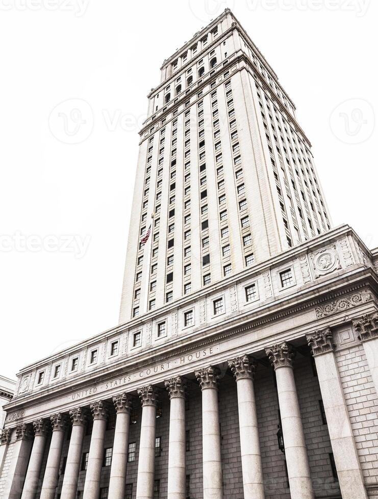 A large building with columns and a clock tower photo