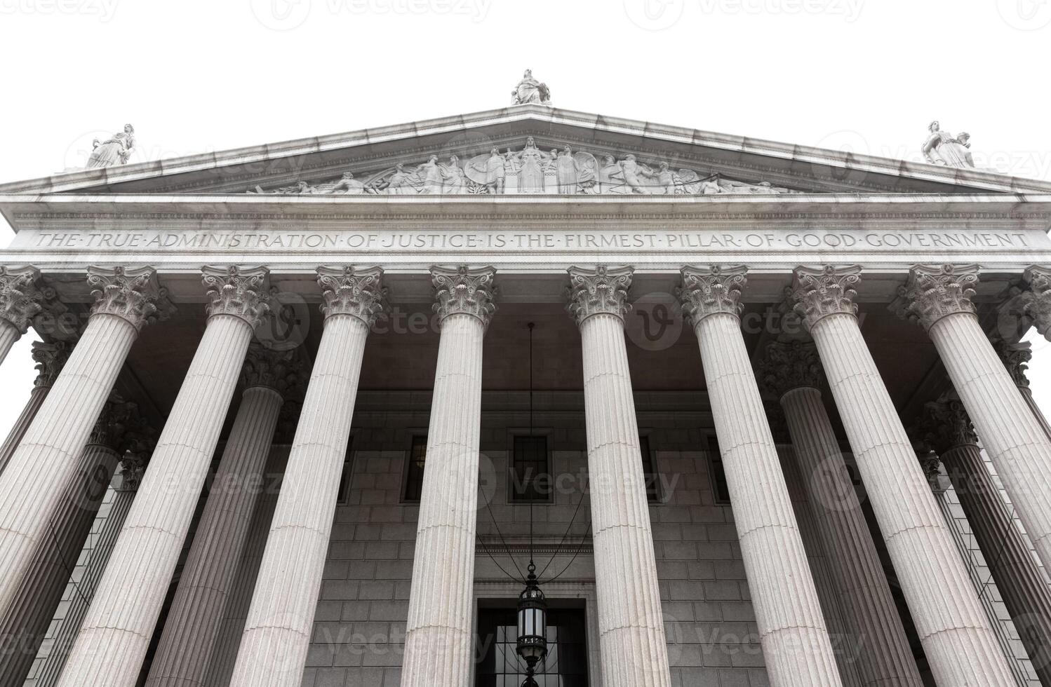 The front of a large building with columns photo