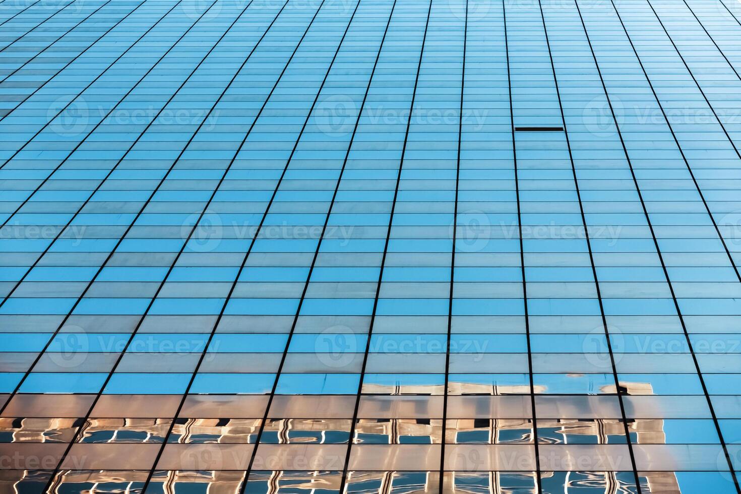 A building is reflected in a glass window photo