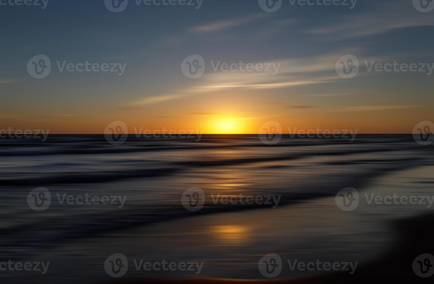 A beach at sunset with waves and a sky photo