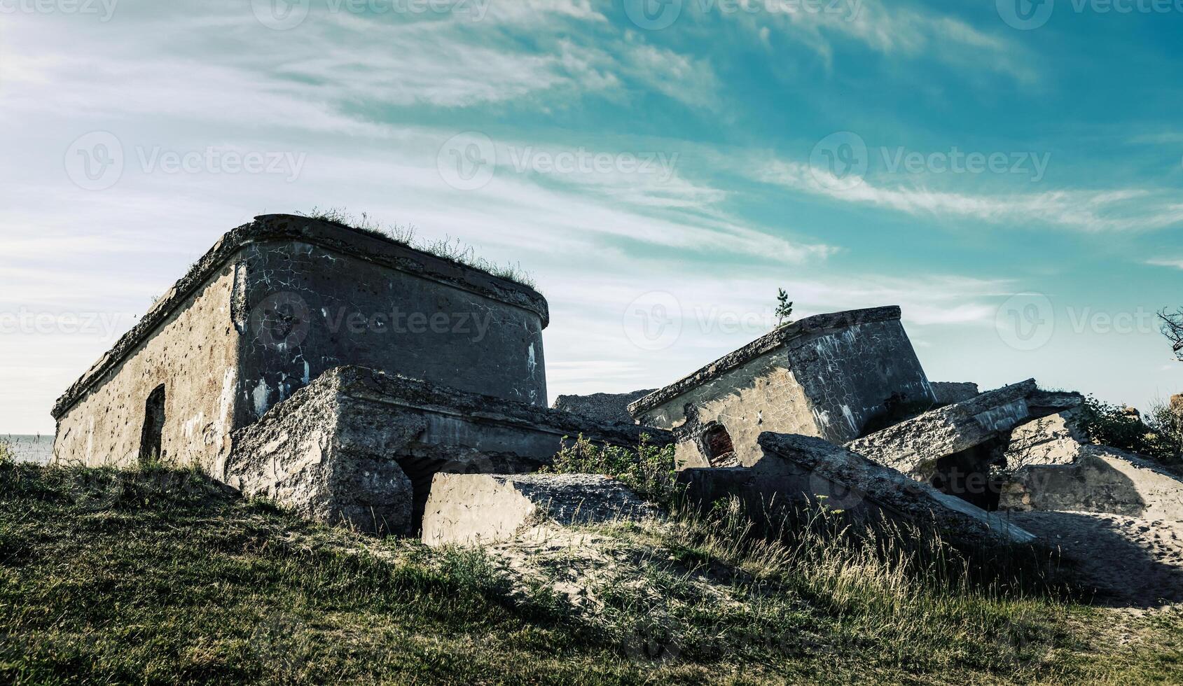 Old fortifications in the middle of a grassy field photo