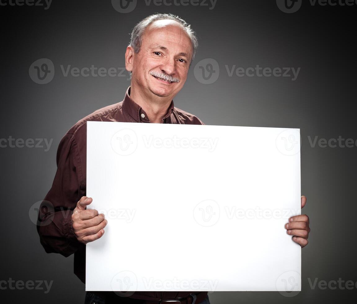 A man holding up a blank sign photo