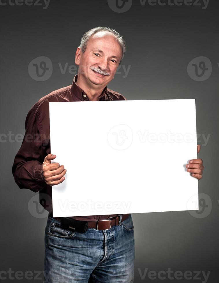 A man holding up a blank sign photo