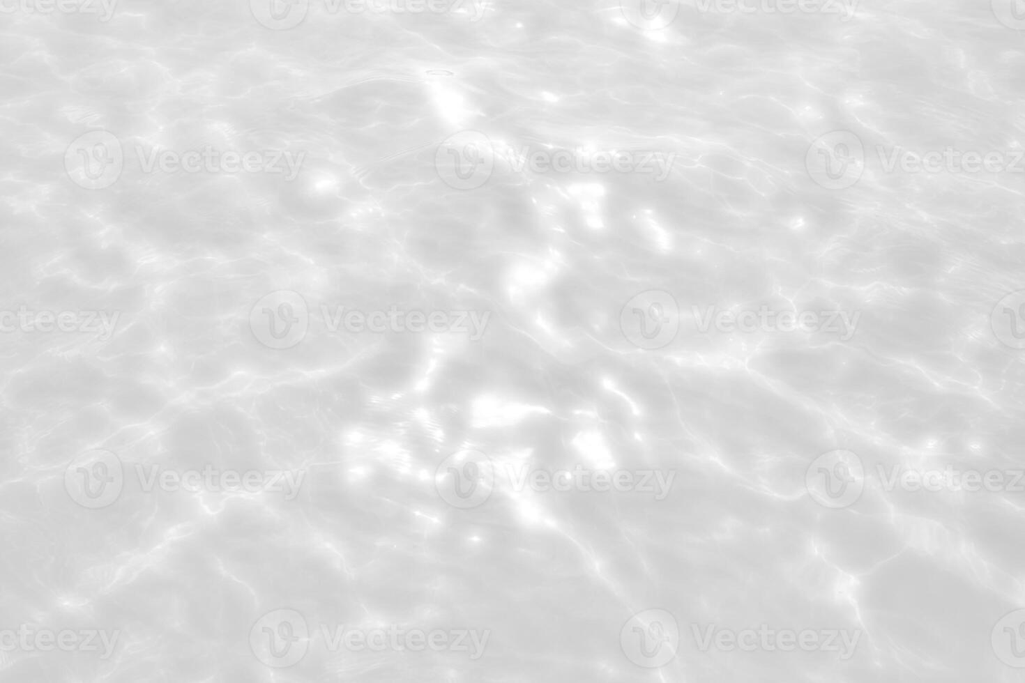 A white surface with some ripples in it photo