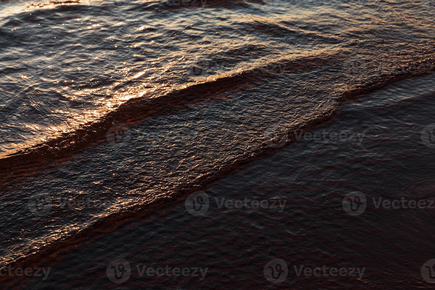 A person is walking on the beach photo