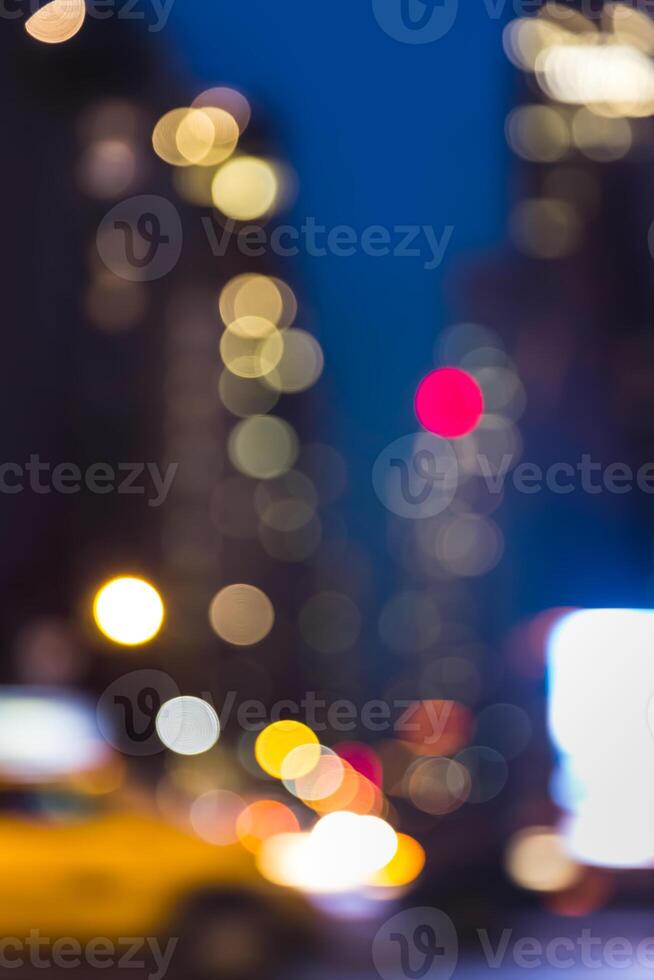 Blurred city lights and traffic lights in new york city photo