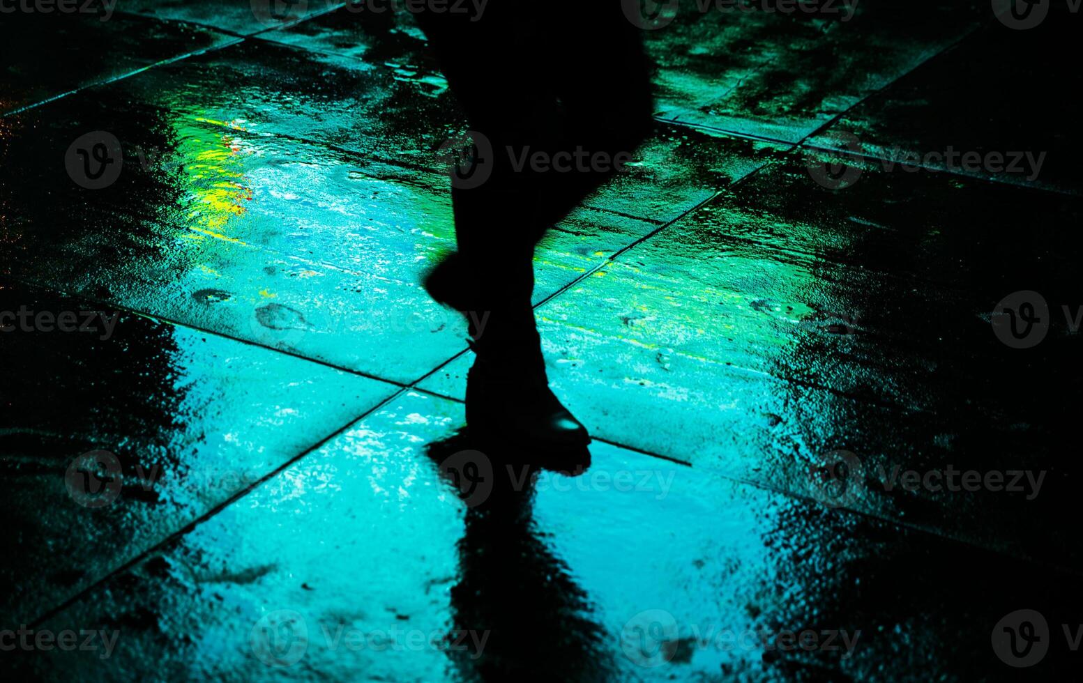 A person walking in the rain photo