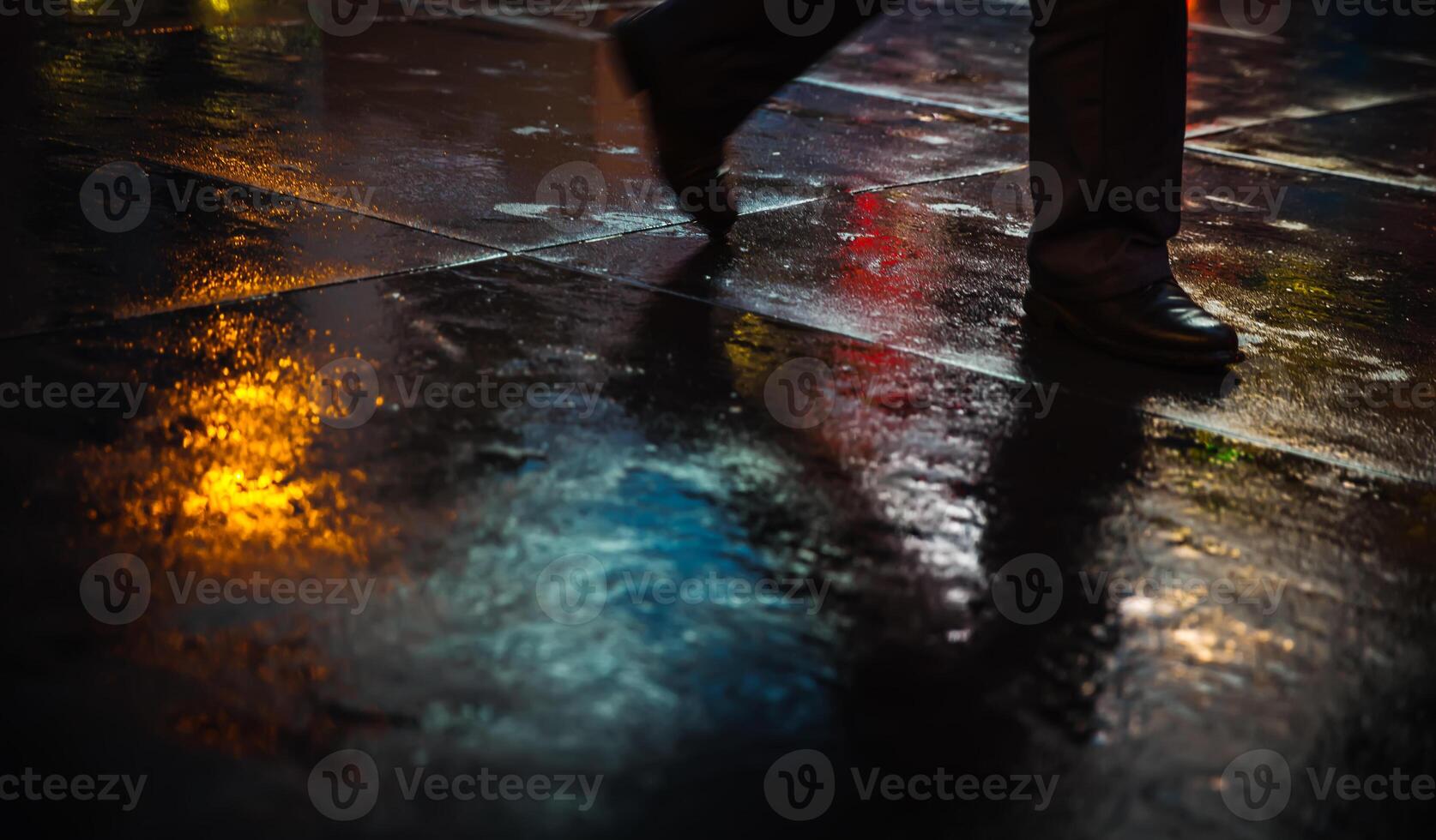 A person walking in the rain photo
