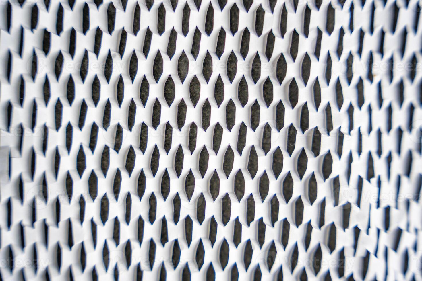 Texture of corrugated white paper for safe transportation, in which the goods brought by the courier delivery service are wrapped, environmental packaging concept. Ecological background. photo