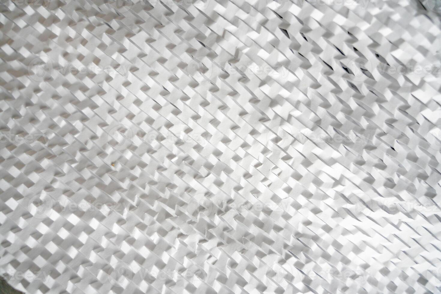 Texture of many layers of corrugated white paper for safe transportation, in which the goods brought by the courier delivery service are wrapped, environmental packaging. Ecological background. photo