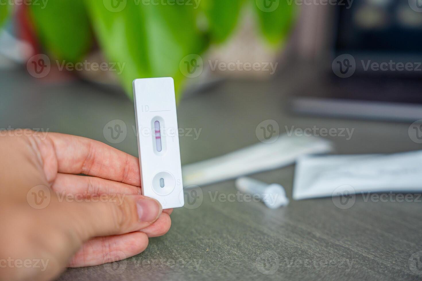 Rapid Antigen Test kit with with Positive result during swab COVID-19 testing. Coronavirus Self nasal or Home test, Autumn exacerbation of viruses. High quality photo