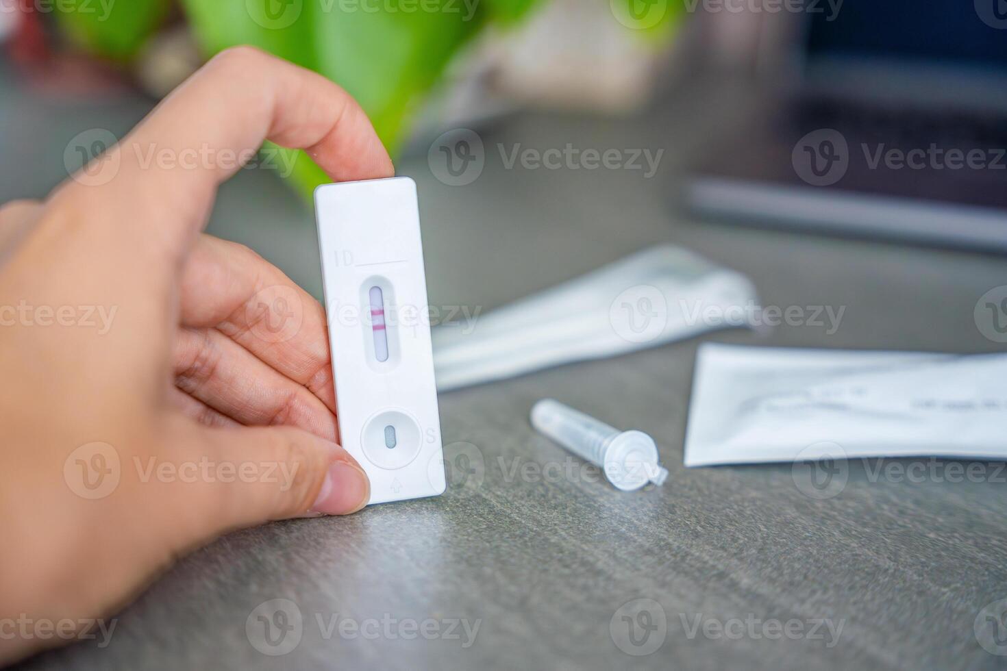 Rapid Antigen Test kit with with Positive result during swab COVID-19 testing. Coronavirus Self nasal or Home test, Autumn exacerbation of viruses. High quality photo