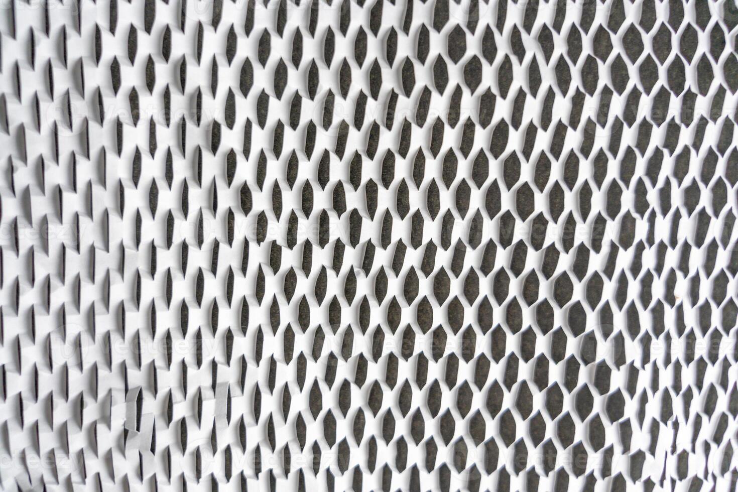 Texture of corrugated white paper for safe transportation, in which the goods brought by the courier delivery service are wrapped, environmental packaging concept. Ecological background. photo