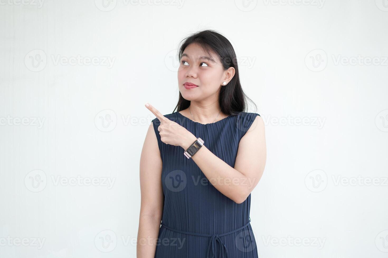Beautiful Asian Woman wearing formal dress pointing side of copy space, promotion and recommendation concept Isolated On White Background photo