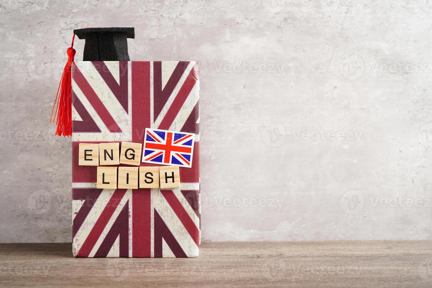 English book with graduate hat, learning and tutorial for foreigner. photo