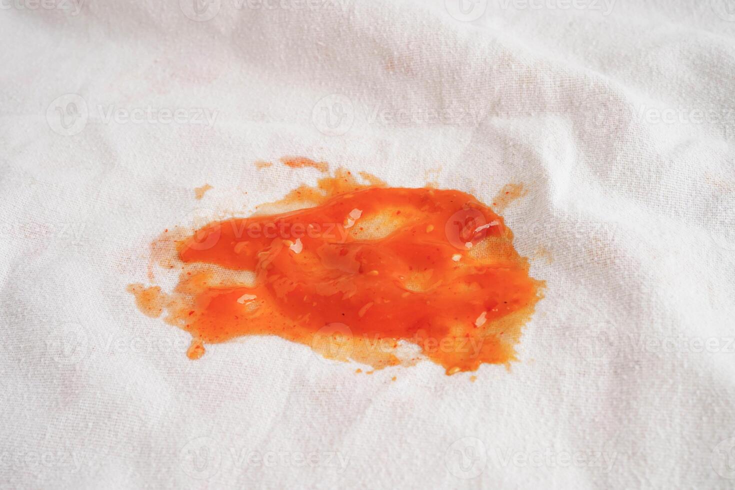 Dirty spicy sauce stain on cloth to wash with washing powder, cleaning housework. photo