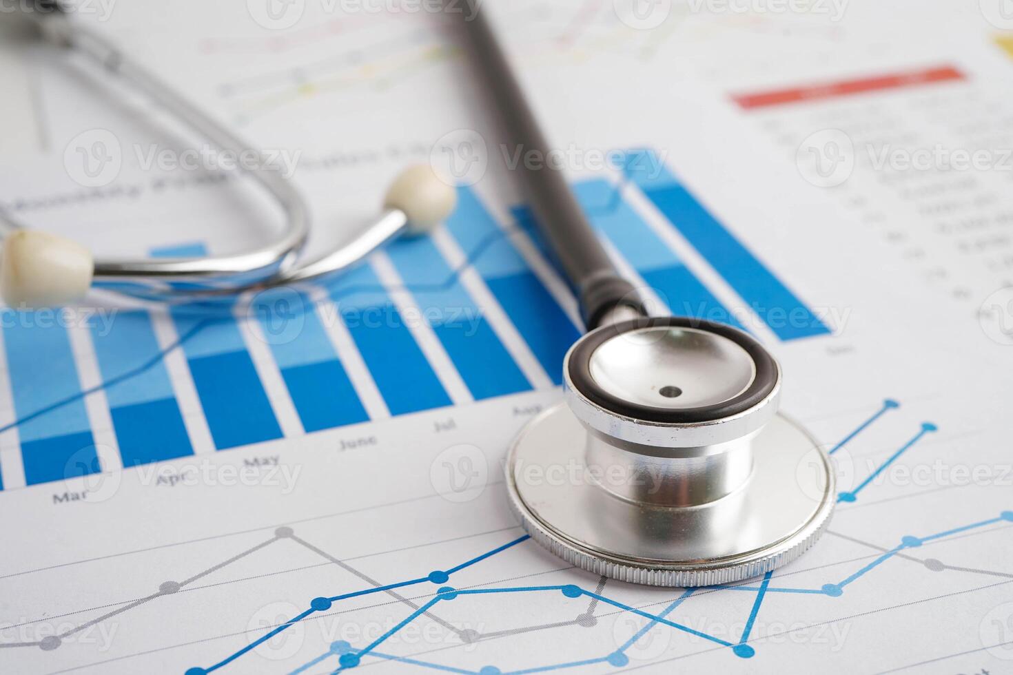Stethoscope on chart or graph paper, Financial, account, statistics and business data medical health. photo