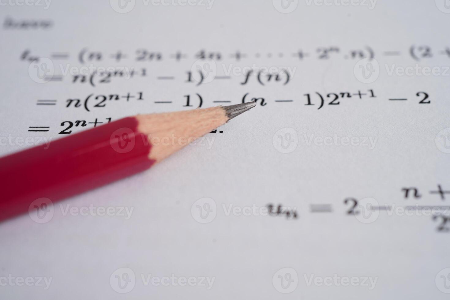Pencil on mathematic formula exercise test paper in education school. photo