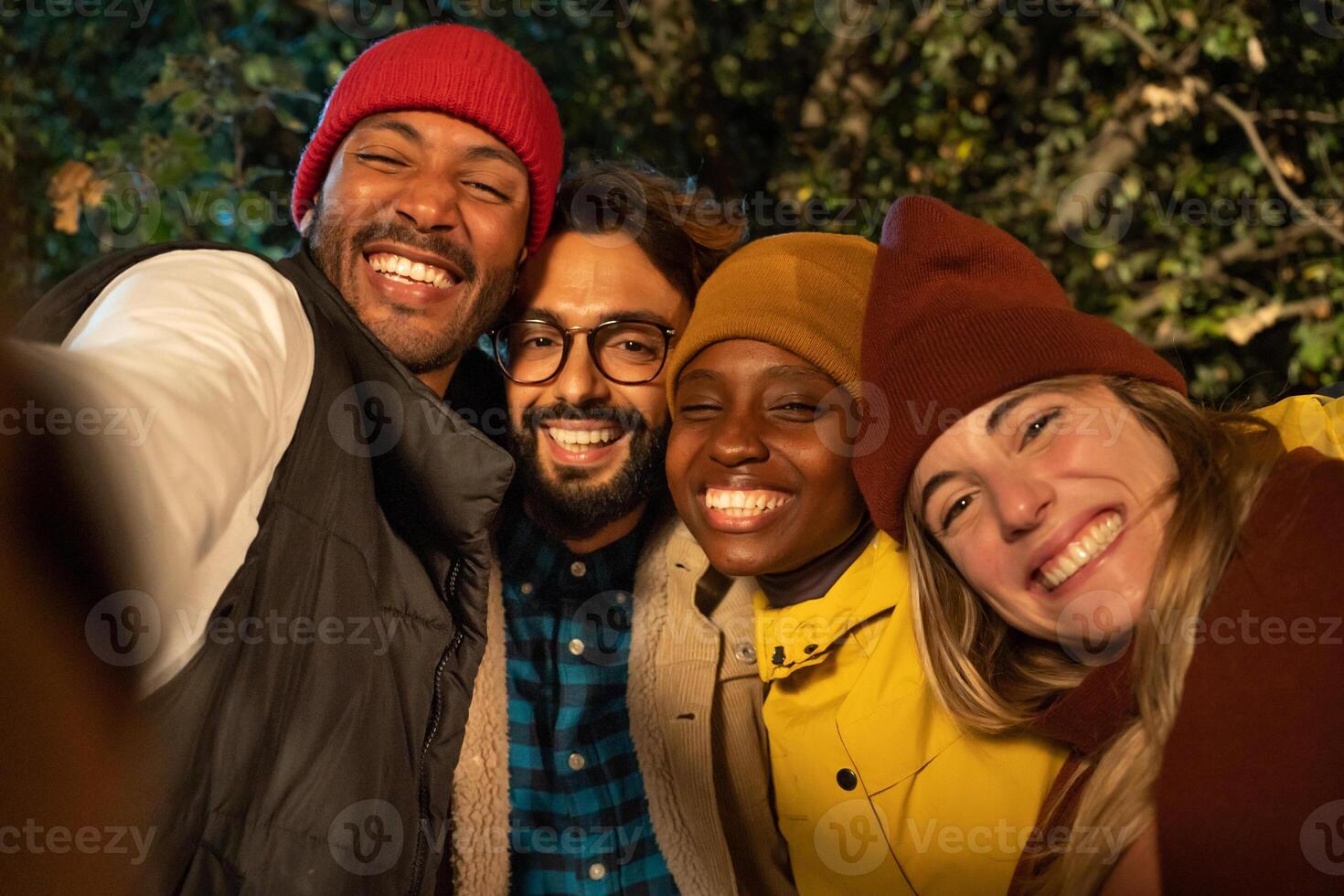 Group of multiethnic friends taking selfie on country hike Happy trekkers on excursion in the nature photo