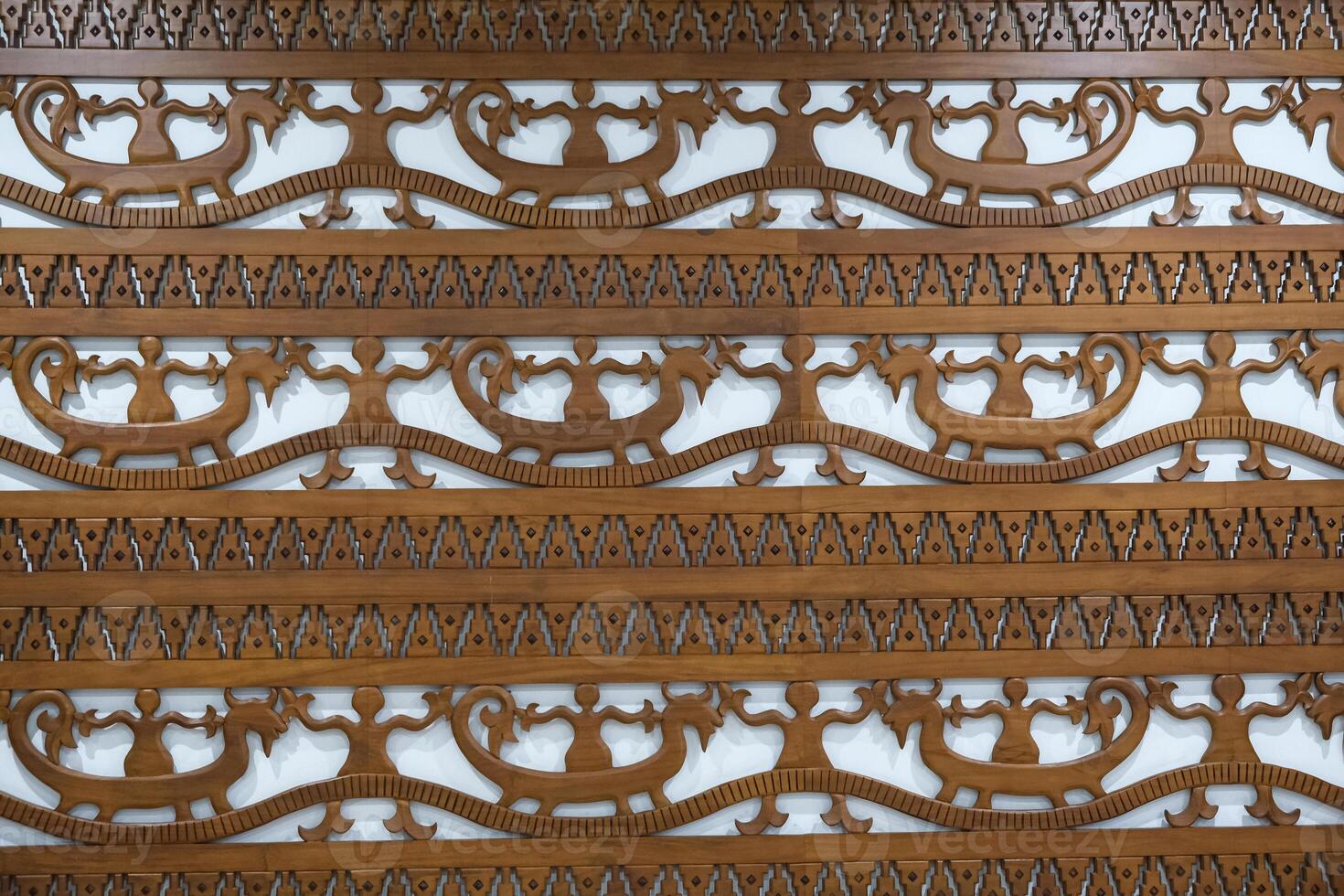 Beautiful decorative wood carving. Wooden patterns ornament photo