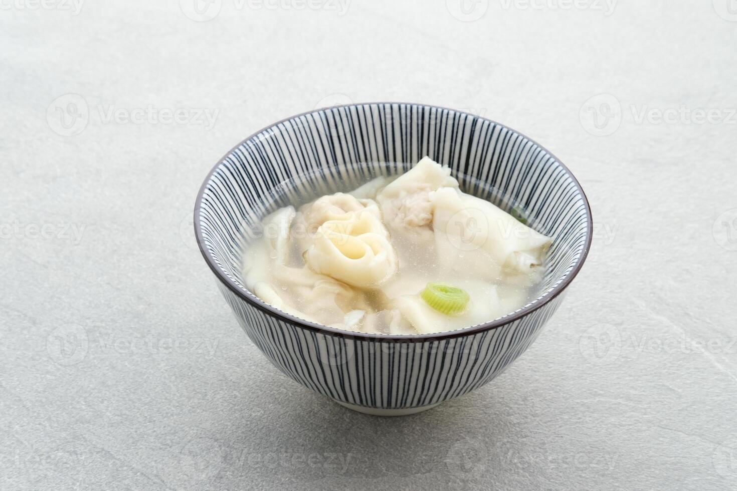 Yummy Wonton Soup or dumpling soup or Pangsit Kuah, served in bowl. photo