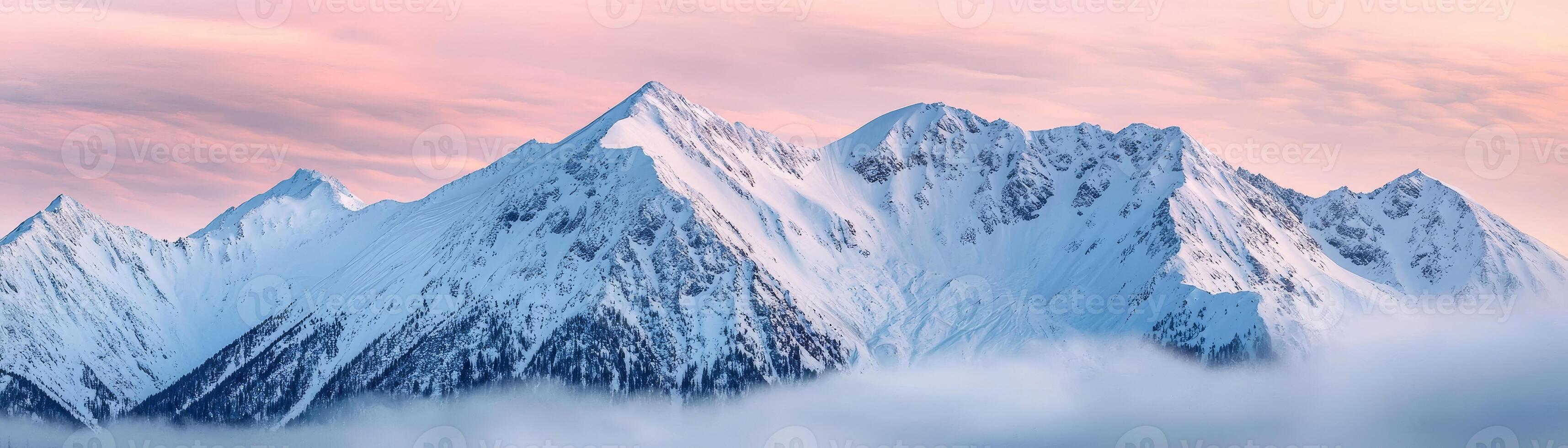 Snowy mountain peaks under a colorful sky, picturesque winter scenery photo