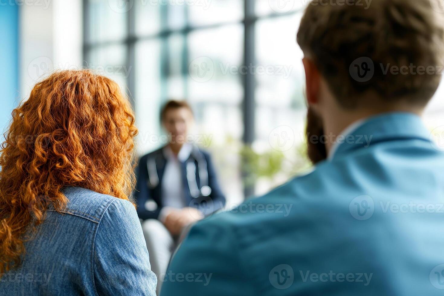 Group of people engaged in a serious discussion in a modern setting. photo