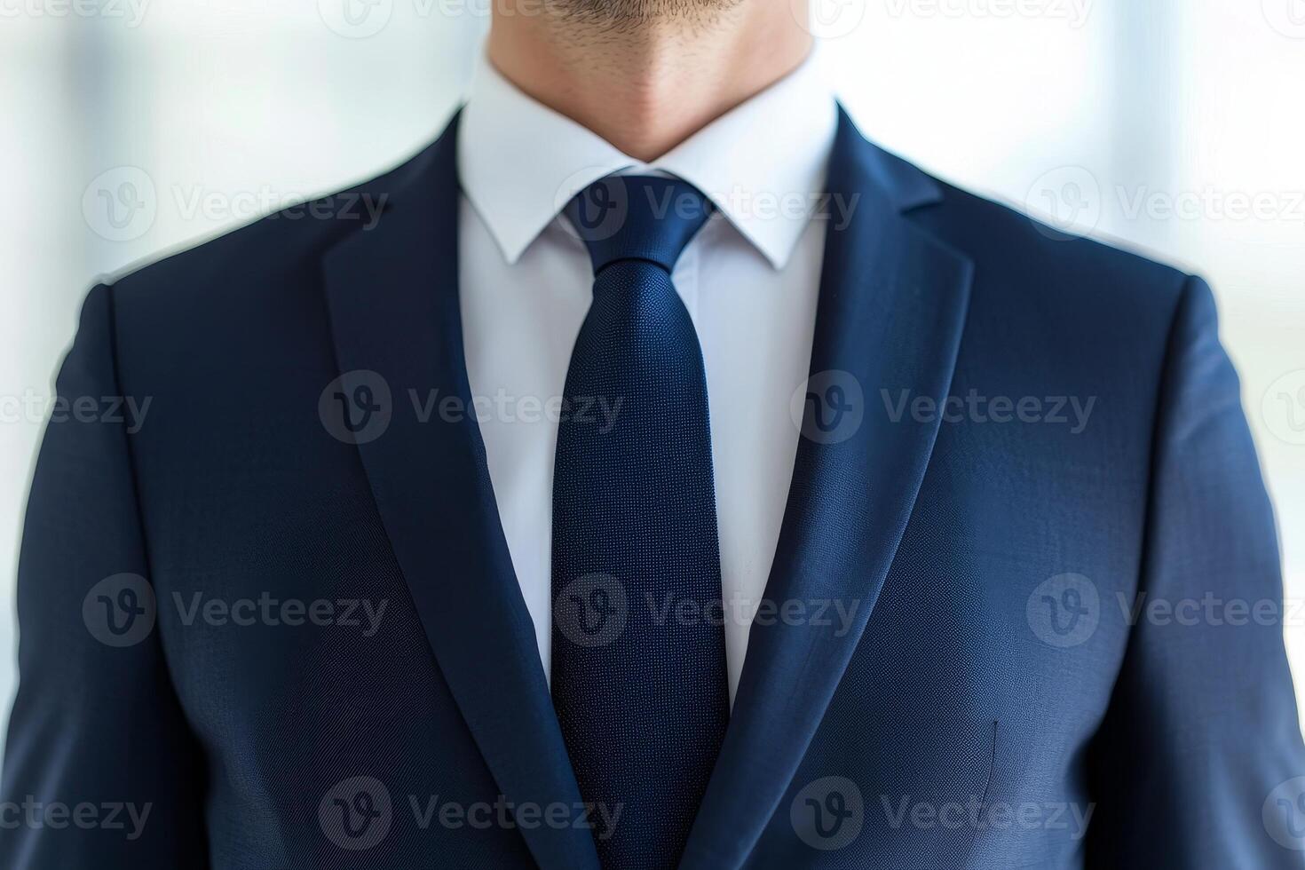 Businessman in formal suit and tie, modern office environment photo