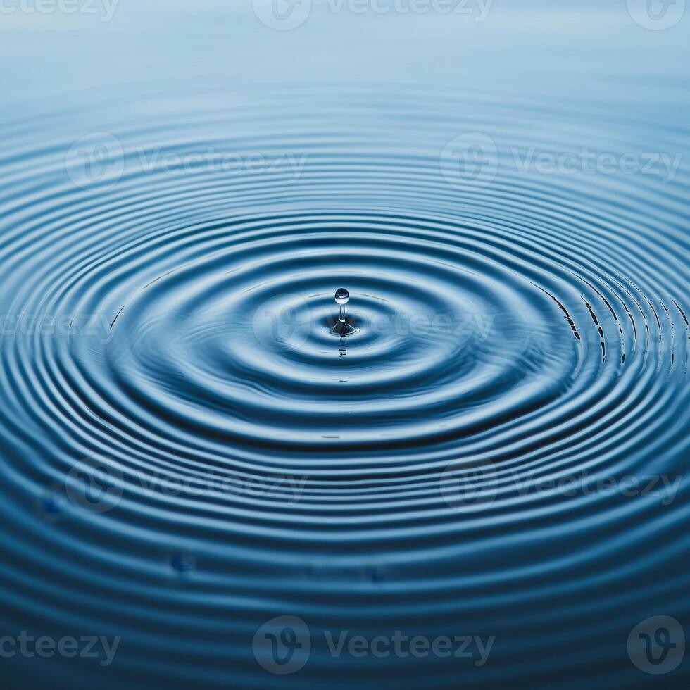 Water ripples creating a serene blue surface pattern. photo