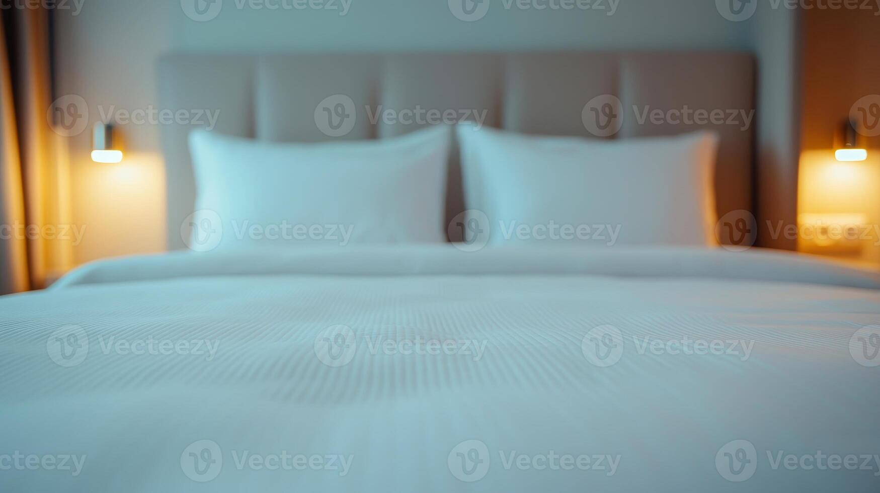 Cozy bedroom with soft white bedding and stylish lamps, inviting restful sleep. photo
