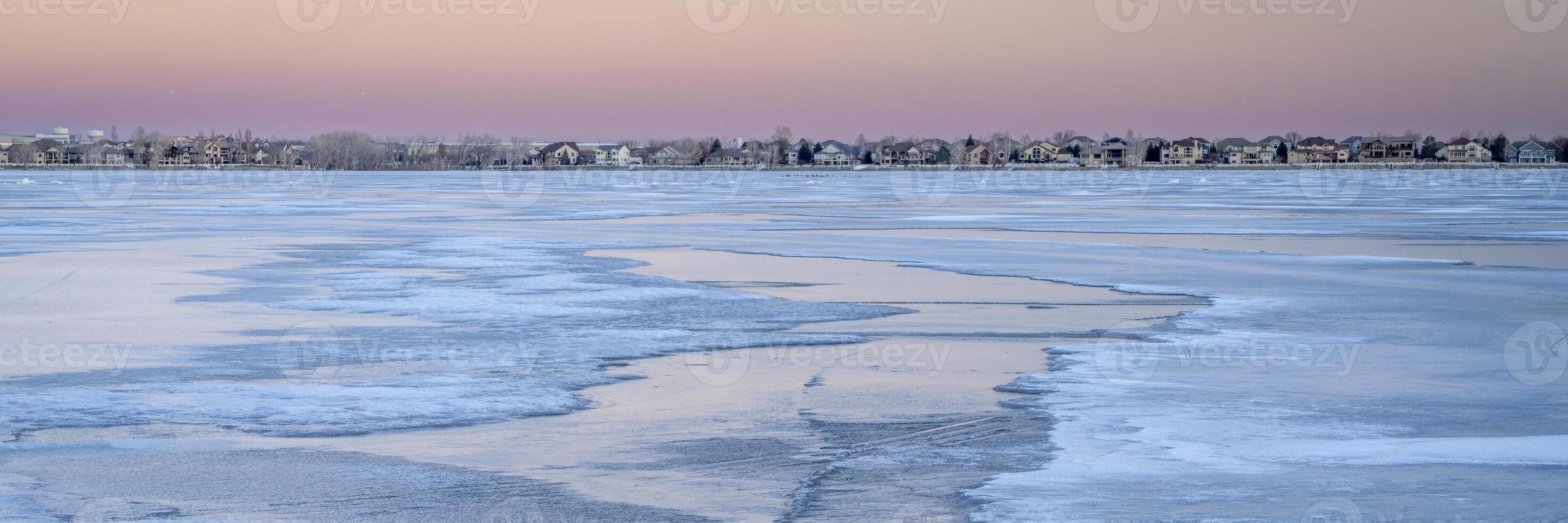 panorama of a dusk over frozen lake in Colorado - Boyd Lake State Park photo
