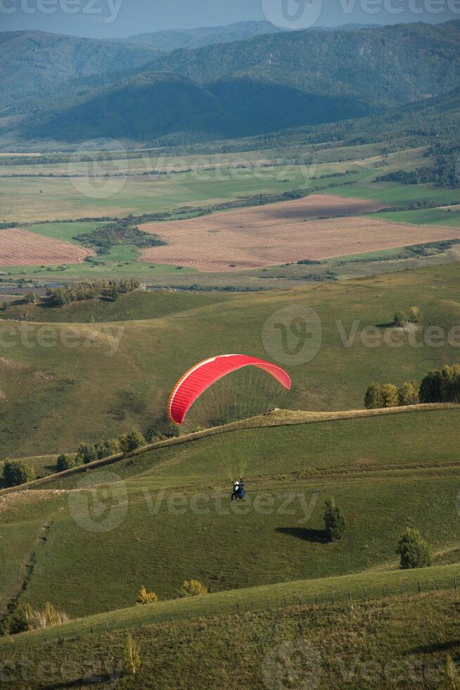Paragliding in mountains photo